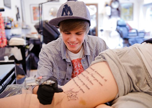 24-year-old Sarah Burgoyne had a verse of a Justin Bieber song tattooed on her thigh as part of a contest to win tickets to the 2011 MTV EMA. MTV arranged for a Bieber lookalike to sign Justin