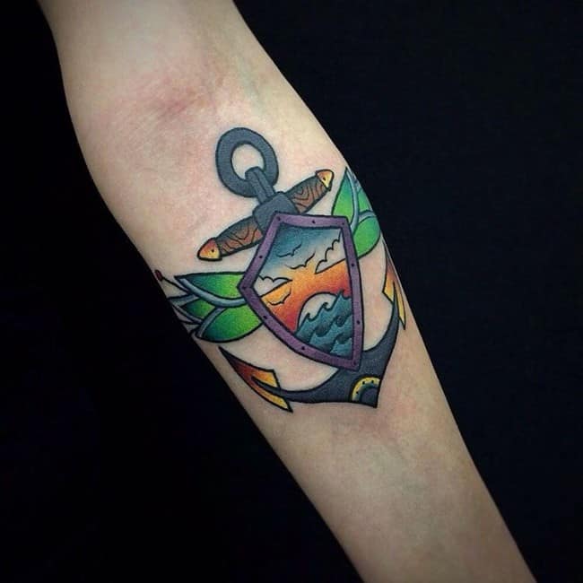 colorful anchor tattoo on forearm