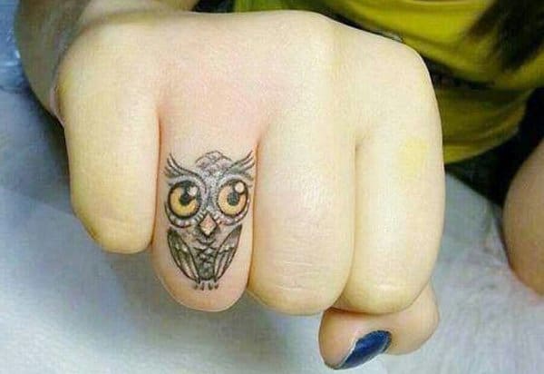 owl finger tattoo