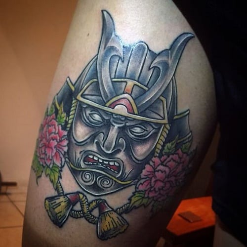 samurai tattoo on upper arm of man