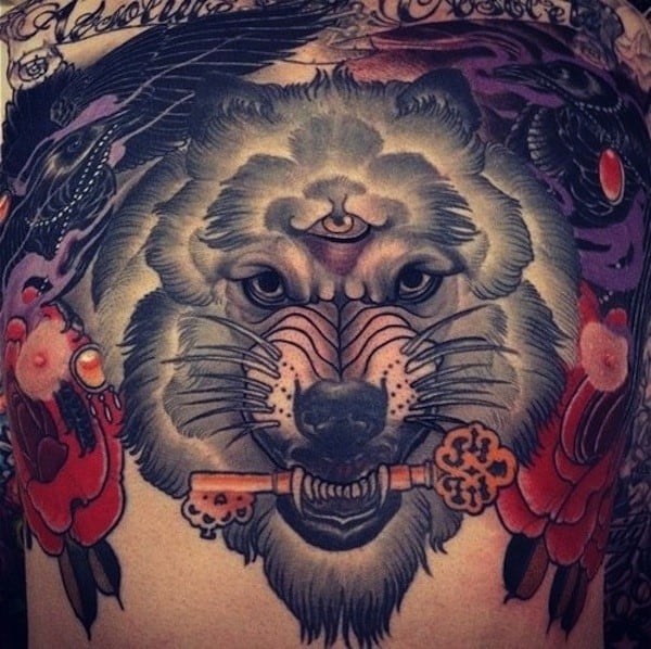 wolf holding a key tattoo