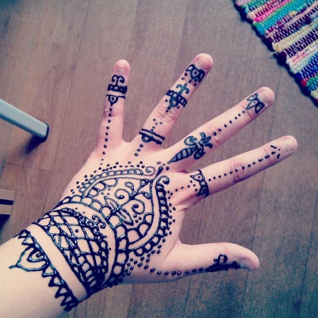 henna tattoo on one hand