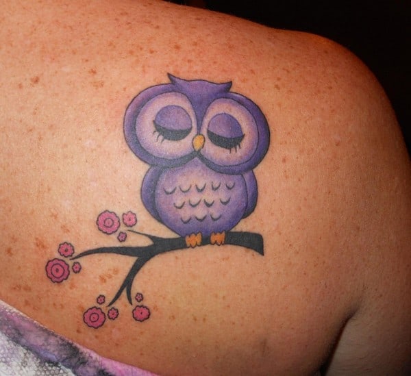 owl tattoo on upper back